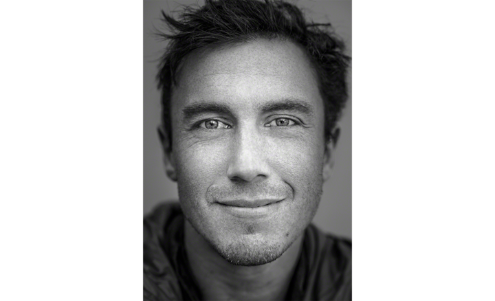 Black & white portrait of photographer Chris Burkard