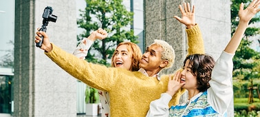 Image of three models shooting selfie